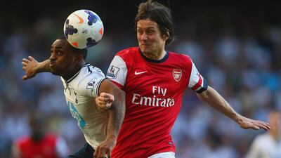 Danny Rose of Tottenham Hotspur and Tomas Rosicky of Arsenal battle for the ball during their English Premier League match at White Hart Lane on March 16, 2014 in London, England. Rosicky's goal 72 seconds from the start and that proved enough for Arsenal to leave with three points. Paul Gilham / Getty Images