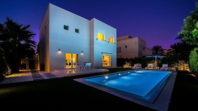 The villa glows as dusk arrives. Courtesy LuxuryProperty.com