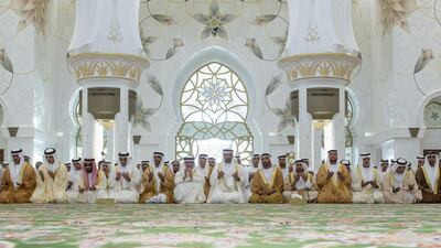Sheikh Mohammed bin Zayed, Crown Prince of Abu Dhabi and Deputy Supreme Commander of the Armed Forces, centre, attends Eid Al Adha prayers at the Sheikh Zayed Grand Mosque. He is seen here with Sheikh Hamed bin Zayed, Chairman of Crown Prince Court - Abu Dhabi and Managing Director of the Abu Dhabi Investment Authority, left, Sheikh Mansour bin Zayed, Deputy Prime Minister and Minister of Presidential Affairs, second left, Sheikh Tahnoon bin Zayed, Deputy National Security Advisor and Chairman of the Presidential Aviation Authority, third left, Lt Gen Sheikh Saif bin Zayed, Deputy Prime Minister and Minister of Interior, fourth left, Sheikh Nahyan bin Zayed, Chairman of the Board of Trustees of Zayed bin Sultan Al Nahyan Charitable and Humanitarian Foundation, fifth left, Sheikh Hazza bin Zayed, National Security Advisor and Vice Chairman of the Abu Dhabi Executive Council, sixth left, Sheikh Saif bin Mohammed, eigth left, Sheikh Suroor bin Mohammed, ninth left, Sheikh Mohammed bin Butti Al Hamed, tenth left, Sheikh Nahyan bin Mubarak, Minister of Culture, Youth and Community Development, eleventh left, and other dignitaries. Ryan Carter / Crown Prince Court - Abu Dhabi