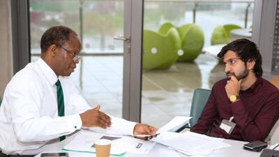 Ambroz Neil, of Alexander Partners, left, helps young people to 'build their career capital and employability. Andrew Simpson / Studio Zero