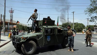 Afghan security forces arrive at the site of an explosion in Kabul, Afghanistan, Monday, July 1, 2019. A powerful bomb blast rocked the Afghan capital early Monday, rattling windows, sending smoke billowing from Kabul's downtown area and wounding dozens of people. (AP Photo/Rahmat Gul)