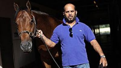 The trainer Musabah al Muhairi with one of his charges at his Oasis Stables.