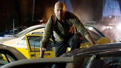 Detective John McClane, played by Bruce Willis, fights off cyber-terrorists in 'Die Hard 4.0'. AP / Fox