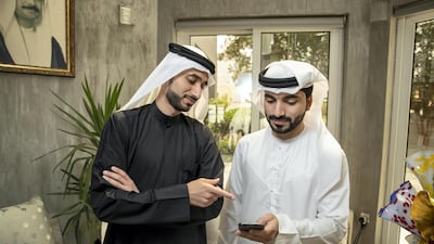 Hesham Alkhazraji and Yousif Almaazmi co-founded an app with Bassam Elshorafa (not pictured) to keep in touch after they returned from university in the US. Antonie Robertson / The National