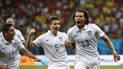 US midfielder Jermaine Jones right celebrates with teammates after scoring. Odd Andersen / AFP Photo