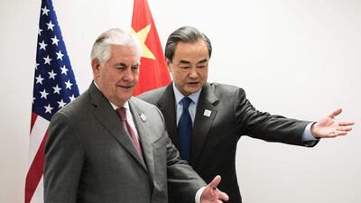 US secretary of state Rex Tillerson and China’s foreign minister Wang Yi take their seats before a meeting on the sidelines of a gathering of G20 foreign ministers in Bonn, Germany on February 17, 2017. Brendan Smialowski / AFP