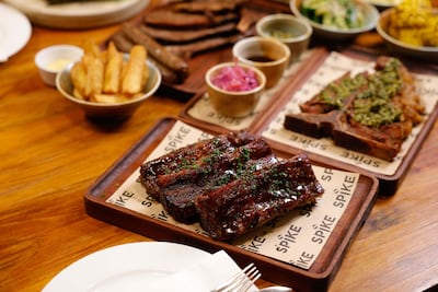 The Emirates Golf Club spot introduces a weekend experience built around slow-smoked meats. Photo: Spike Bar