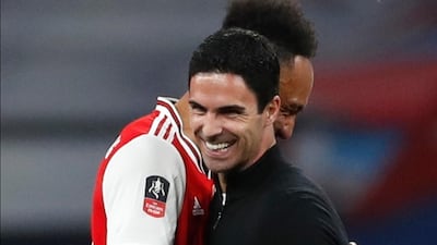 Pierre-Emerick Aubameyang with Arsenal manager Mikel Arteta after the win. EPA
