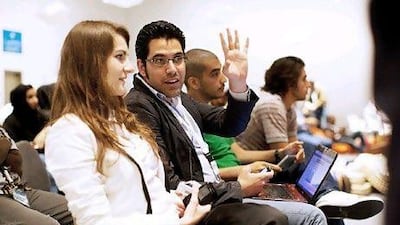 Salim Akil, second from left, had to outsource his website businesses and relocate following the uprising in Syria. Christopher Pike / The National