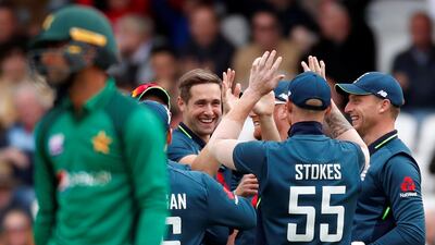 England's Chris Woakes celebrates with teammates after taking the wicket of Pakistan's Fakhar Zaman at Headingley. Reuters