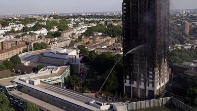 Firefighters at work after a deadly blaze at Grenfell Tower, a high rise apartment block in London on Wednesday, June 14, 2017, where at least 17 pdied and many more are still missing. Alastair Grant / AP Photo