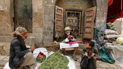 People sit at a market in the old city of Sanaa, Yemen. EPA