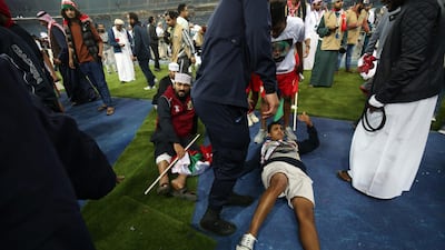 Wounded fans await treatment after a glass barrier broke at the end of the Gulf Cup of Nations 2017 final football match between Oman and the UAE at the Sheikh Jaber al-Ahmad Stadium in Kuwait City on January 5, 2018. Yasser Al-Zayyat / AFP