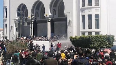 Police officers use water cannon to disperse people protesting after parliament appointed upper house chairman Abdelkader Bensalah as interim president in Algiers, Algeria. Reuters