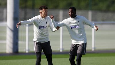 Tottenham Hotspur's Pape Matar Sarr and Ivan Perisic during training. Reuters