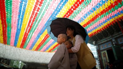 Novice monks walk underneath lotus lanterns bearing prayers after an event celebrating the upcoming Vesak Day, the birthday of Buddha, at Jogye temple in Seoul, South Korea. Kim Hong-Ji / Reuters