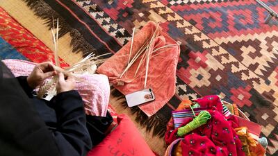 Khoos palm fronds are woven into traditional items for the home and to sell. Reem Mohammed / The National