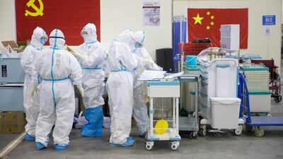 Medical staff in protective suits work at Wuhan Fang Cang makeshift hospital in Wuhan, Hubei Province, China. EPA