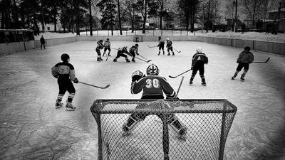 In this image released by World Press Photo titled “Vetluga’s Hockey” by photographer Vladimir Pesnya which won the first prize in the Sports Stories category shows the match between junior teams from Vetluga and village Sharanga in Vetluga, Russia, Feb. 19, 2015. Vetluga’s hockey players of an amateur team in provincial Russia are photographed before, during and after a game in the regional championship in Vetluga, Nizhny Novgorod Oblast, Russia. Vladimir Pesnya / World Press Photo via AP