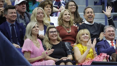 British singer Rick Astley, top left, American singer Debbie Gibson, bottom left, and comedian Jerry Seinfeld, waving, at the US Open final. EPA