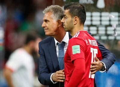 Iran manager Carlos Queiroz, left, is determined to guide his team to the knockout stages. Robert Ghement / EPA