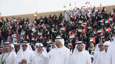 Audience members watch the Union March during the Sheikh Zayed Heritage Festival. Mohamed Al Suwaidi / Crown Prince Court - Abu Dhabi