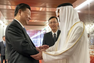 Sheikh Mohamed bin Zayed, Crown Prince of Abu Dhabi and Deputy Supreme Commander of the UAE Armed Forces, bids farewell to China President Xi Jinping, at the Presidential Airport following a state visit in 2018. Mohamed Al Hammadi / Crown Prince Court - Abu Dhabi