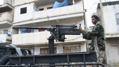A resistance fighter mans a machine gun on the back of a patrol truck in the south-western city of Taiz on November 12, 2015. Resistance forces, backed by the Arab coalition, are battling Houthi rebels for control of the city. Anees Mahyoub/Reuters