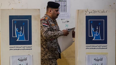 An Iraqi soldier prepares to vote at a polling station in Baghdad. AFP
