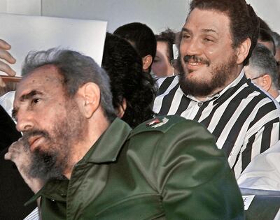 Nuclear physicist Fidel Castro Diaz-Balart, right, with his father Fidel Castro at the opening of the Havana Book Fair in February, 2002. Adalberto Roque / AFP