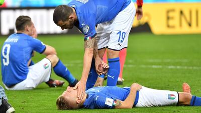 Italy's defender Leonardo Bonucci and teammate forward Ciro Immobile show their dejection. EPA/DANIEL DAL ZENNARO