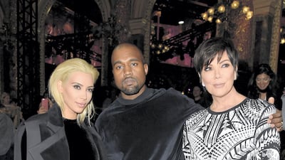 Kim Kardashian, Kanye West, in Balmain, and Kris Jenner attend the Balmain show as part of Paris Fashion Week on March 5, 2015 in Paris, France. Getty Images