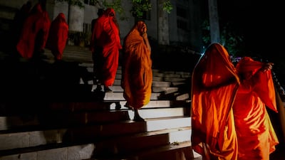 Sri Lankan monks are taken to a detention centre in Colombo after a court hearing in Negombo. The 22 monks returned from Thailand allegedly carrying 110kg of cannabis. AFP