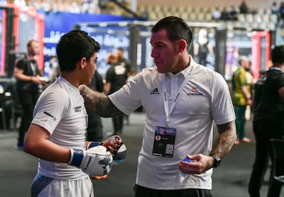 UAE coach, Tolly Plested supports his fighters on the opening day for IMMAF Youth World Championships, Mubadala Arena at Zayed Sports City, Abu Dhabi. Khushnum Bhandari / The National