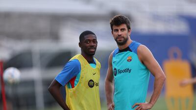 Ousmane Dembele and Gerard Pique during training. Getty