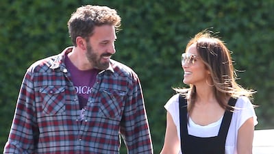 Ben Affleck and Jennifer Lopez in Los Angeles. Lopez is wearing tailored black dungarees. GC Images