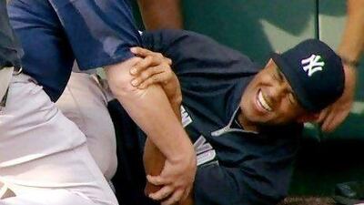 Mariano Rivera, centre, grimaces after twisting his right knee shagging fly balls during batting practice. Originally thought to not be too serious, the injury turned out to be a torn anterior cruciate ligament in the knee.