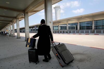 A departing passenger at the nearly deserted Ben Gurion airport in Lod, near Tel Aviv, on May 13. AFP