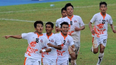Bhutanese football player Tshering Dorji, left, celebrates after scoring the winner on Thursday in his team's World Cup qualifying win over Sri Lanka. Ishara S Kodikara / AFP / March 12, 2015