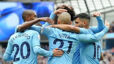 Manchester City's David Silva celebrates with teammates after scoring his side's second goal against Fulham - their 34th unbeaten match in a row against promoted teams at the Etihad Stadium. AP Photo