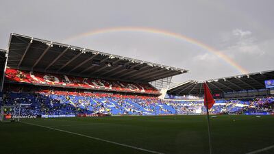 A rainbow is seen before the UEFA Super Cup football match between Real Madrid and Sevilla at Cardiff City Stadium in Cardiff, south Wales on August 12, 2014. AFP PHOTO / GLYN KIRK