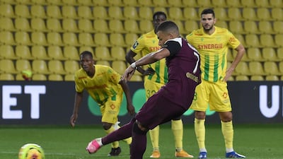 Paris Saint-Germain's French forward Kylian Mbappe score a penalty. AFP