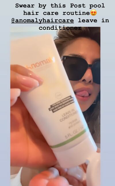 Chopra using her Anomaly Haircare leave-in conditioner after spending the day in the pool. Photo: Instagram / Priyanka Chopra