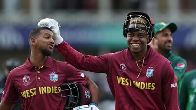West Indies' Nicholas Pooran, left, and teammate Shimron Hetmyere leave the field after beating Pakistan. AP Photo