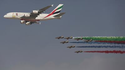 An Emirates Airline A380 leads the Al Fursan aerobatic display team during the opening ceremony in 2017. AP Photo / Kamran Jebreili