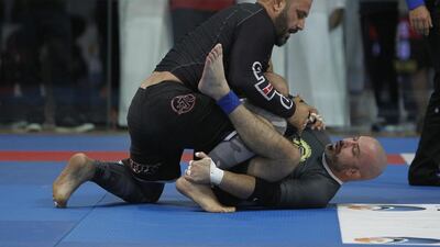 Ammar Mofei (Jordan, + 76 kg) on his way to victory against the tough Carlos Augusto Junior (Brazil, + 76 kg) during their weight division Jiu Jitsu match. Jeffrey E Biteng / The National