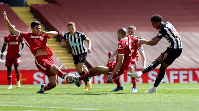 Newcastle United's Joe Willock scores in injury-time as the Premier League game against Liverpool finishes 1-1 on Saturday, April 24. Reuters
