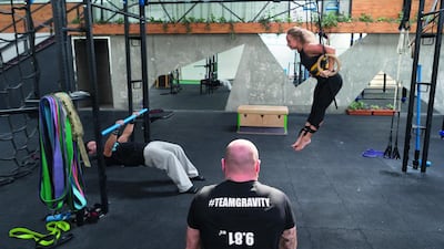 From left, Kenneth Gallarzo and Marina Pavlenko at Dubai’s Gravity Calisthenics Gym. Antonie Robertson/The National