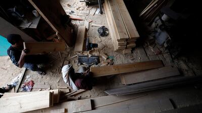 A Yemeni labourer works at a wood shop on International Labour Day in the country's capital, Sanaa. International Labour Day, or May Day, is observed annually on 1 May around the world and celebrates workers, their rights, achievements and contributions to society. EPA