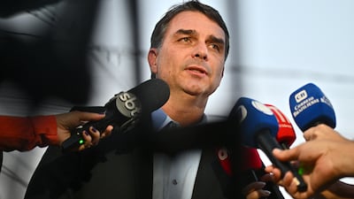 Brazilian senator Flavio Bolsonaro, son of the former president, addresses the media in Brasilia. EPA